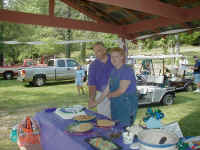 Cutting_the_cake_at_Brown_Mtn..JPG (210677 bytes)